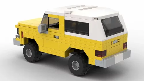 LEGO GMC Jimmy 78 scale brick model in yellow color on white background rear view angle
