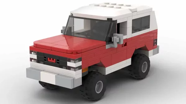 LEGO GMC Jimmy 86 scale brick model in two tone red and white color scheme on white background
