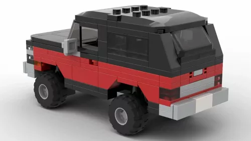 LEGO GMC Jimmy 90 scale brick model in red and black color scheme on white background rear view angle
