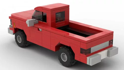 GMC C10 High Sierra 77 scale brick model in red color on white background rear view angle