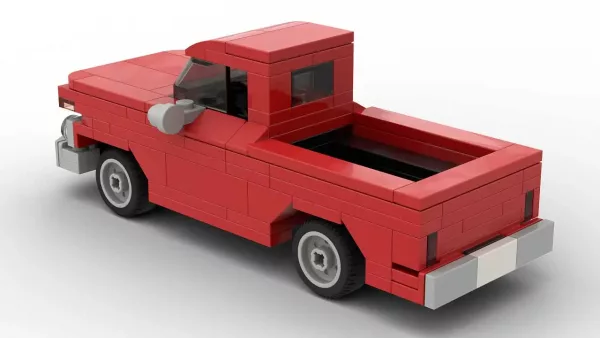 LEGO Chevrolet C10 Pickup 65 scale brick model in red color on white background rear view angle