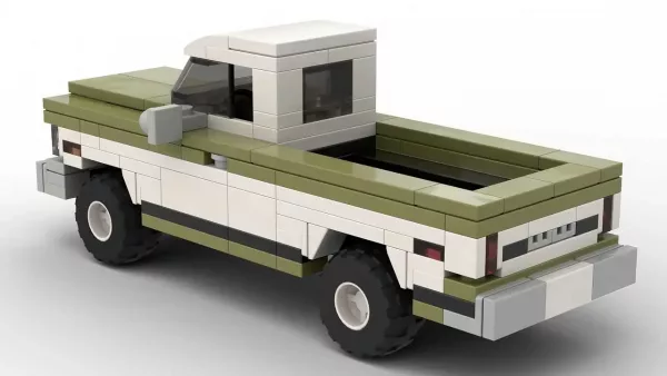 LEGO Chevrolet C20 Pickup 72 scale brick model in two tone dark green and white paint scheme on white background rear view angle