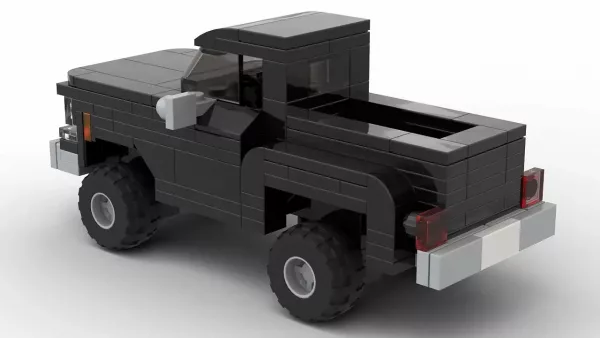 LEGO GMC K15 High Sierra Fenderside 77 scale brick model in black color on white background rear view angle