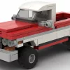 LEGO GMC K1500 72 scale brick model in two tone red and white pain scheme on white background