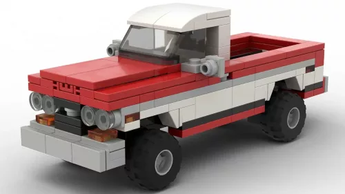 LEGO GMC K1500 72 scale brick model in two tone red and white pain scheme on white background