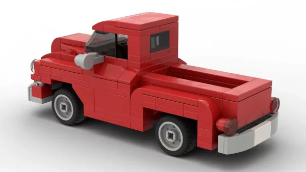 LEGO Chevrolet Pickup 1955 scale brick model in red color on white background rear view angle