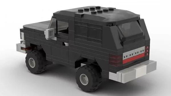 LEGO Dodge Ramcharger 92 scale brick model in black color on white background rear view angle