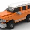 LEGO GMC Suburban 68 scale brick model in orange color on white background