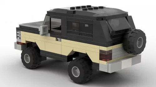 LEGO Plymouth Trail Duster 79 scale brick model in two tone black and tan color scheme on white background rear view angle