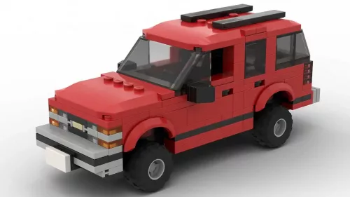 LEGO Chevrolet Tahoe 98 4 door scale brick model in red color on white background