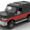 LEGO GMC Suburban 90 scale brick model in two tone red and black color scheme on white background