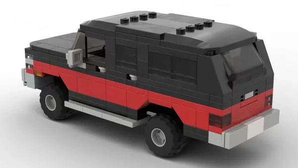 LEGO GMC Suburban 90 scale brick model in two tone red and black color scheme on white background rear view angle