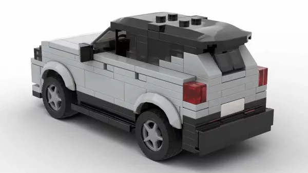 LEGO Volvo EX40 25 scale brick model in gray color on white background rear view angle