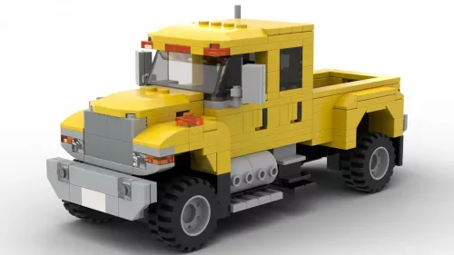 LEGO International CXT 06 scale brick model in yellow color on white background