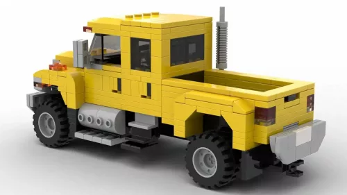 LEGO International CXT 06 scale brick model in yellow color on white background rear view angle